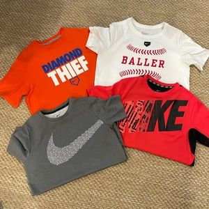 Lot of 4 Youth boys’ Nike short- sleeved shirts